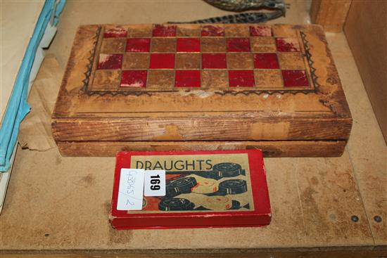 Chess board & ivory pieces and wooden set of draughts